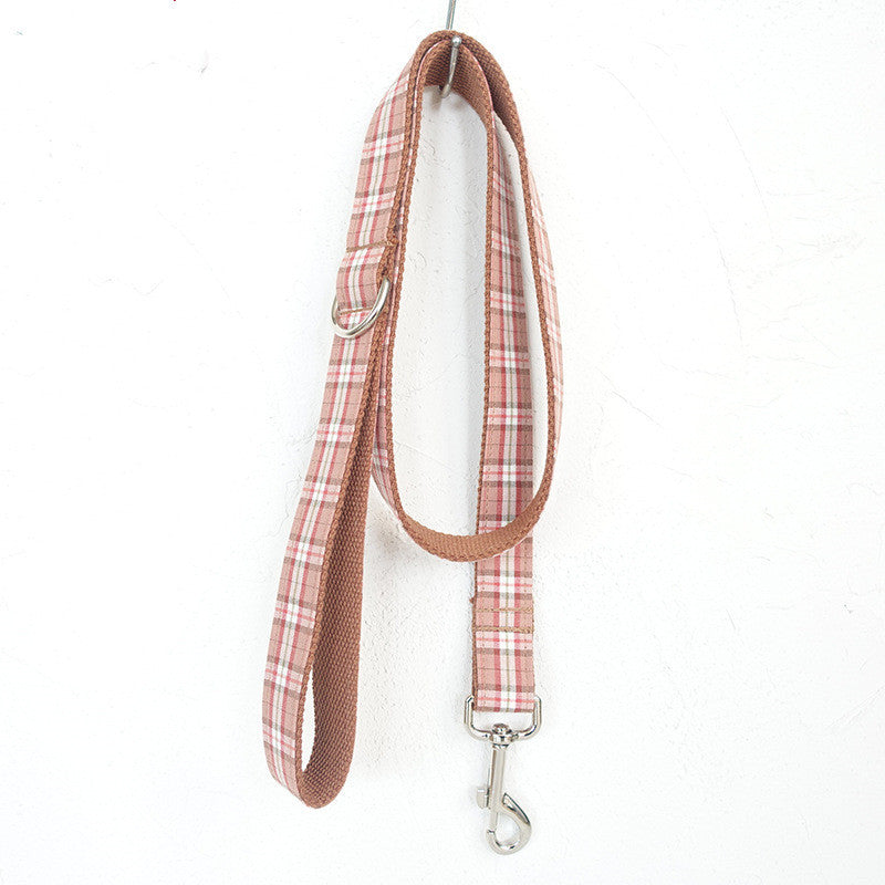 Plaid dog leash with metal clip on a white background