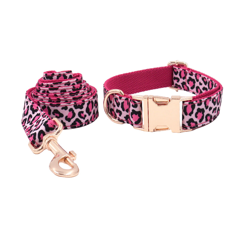 Pink leopard print dog collar and leash set on a white background
